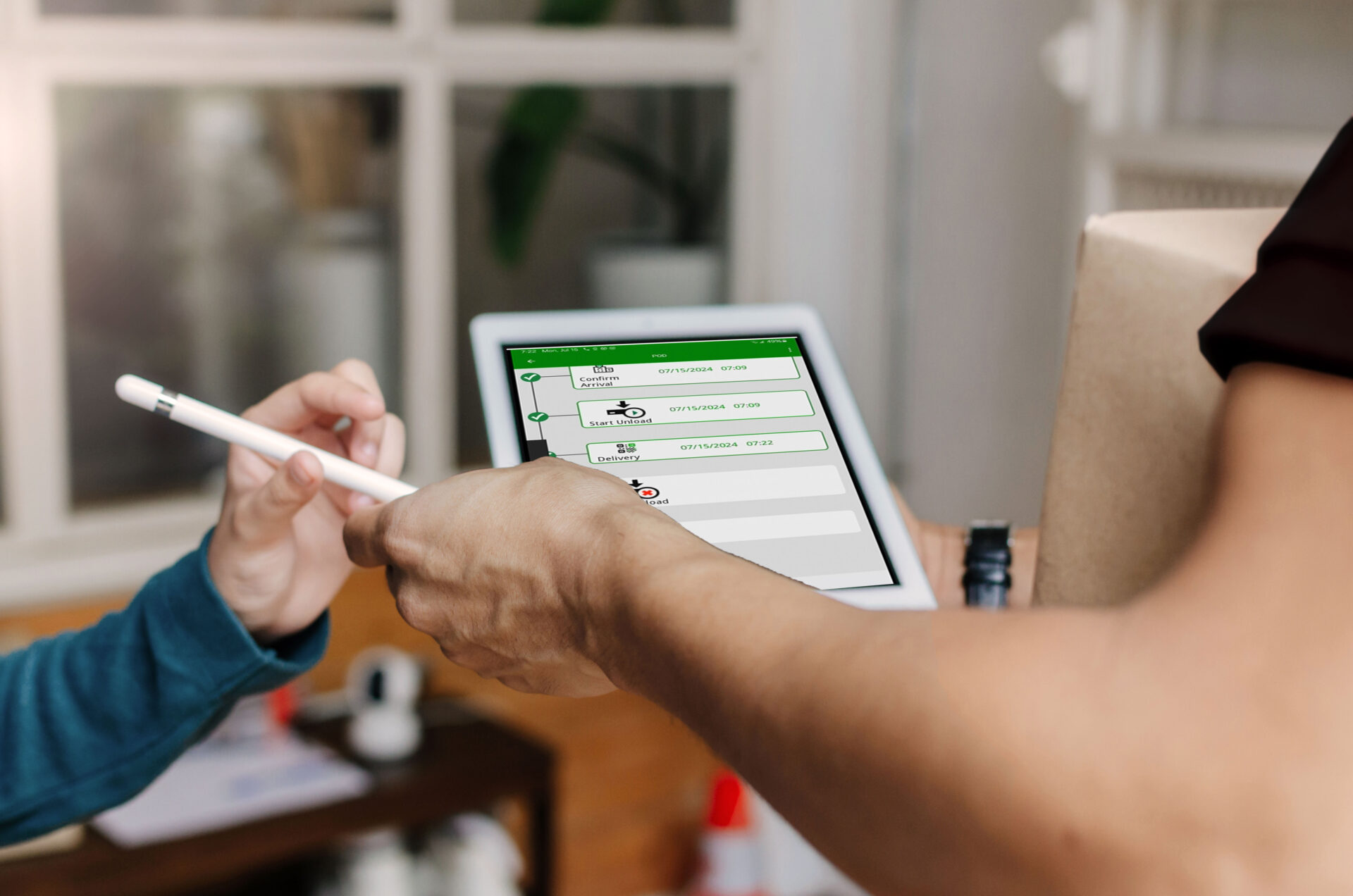 Hand holding a stylus and tablet, signing POD APP